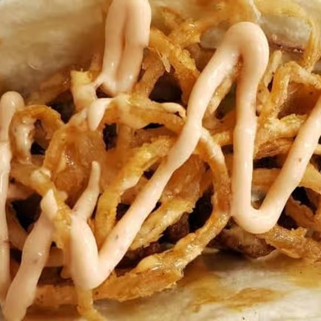 Crispy Onion Steak Taco.